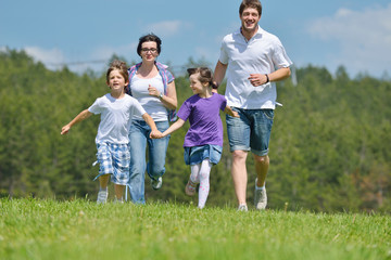 Fototapeta premium happy young family have fun outdoors