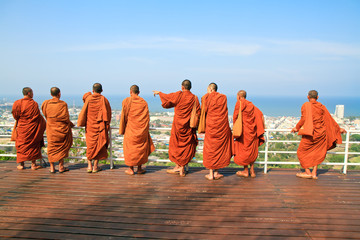 Group monk standing on the view point of HuaHin mountain