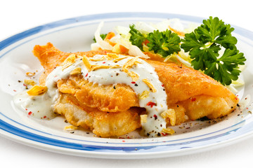 Fish dish - fried fish fillets and vegetable salad