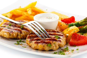 Grilled steak, French fries and vegetables