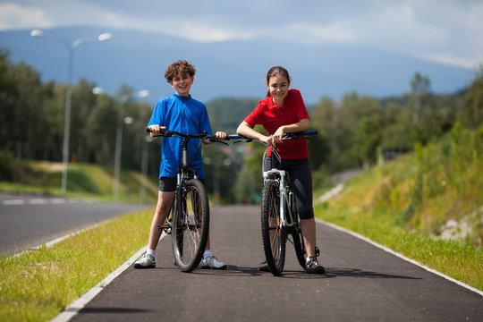 Girl and boy biking