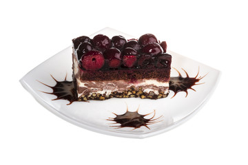 Chocolate cake with cherry on top on a white background