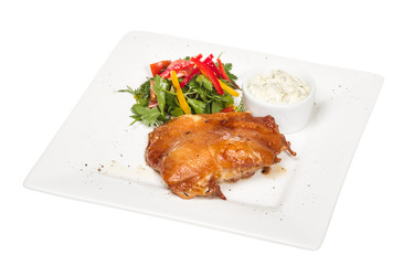 roasted chicken with vegetables on a white plate