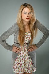 A beautiful young woman is in brown clothes