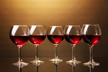 Wineglasses on brown background