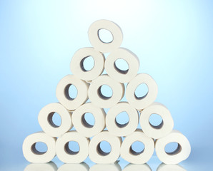 rolls of toilet paper on blue background