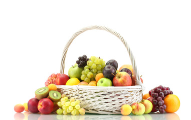 Naklejka na ściany i meble Assortment of exotic fruits in basket isolated on white