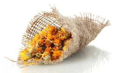 dried calendula flowers in sacking, isolated on white.