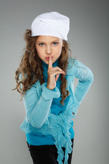 A little beautiful girl is in autumn clothes