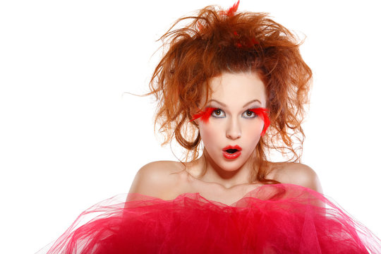 beautiful redheaded girl with red feathers