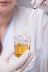 Woman making urine test