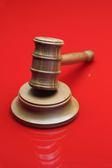 Judge's Gavel on red background