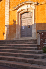 Fototapeta na wymiar The doorway to the church in Roussillon, Provence
