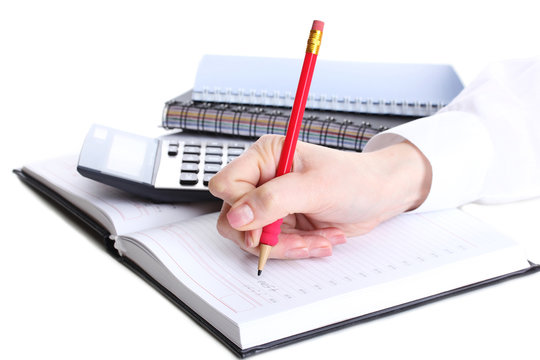 women hands with pencil, notebook and Calculator isolated