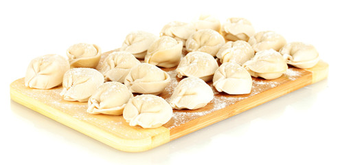Raw Dumplings on cutting board isolated on white