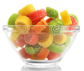 colorful jelly candies in glass bowl isolated on white.