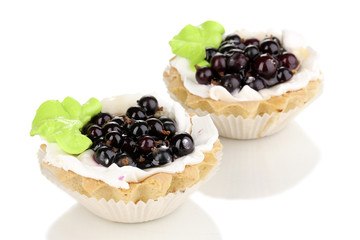 sweet cakes with berries isolated on white