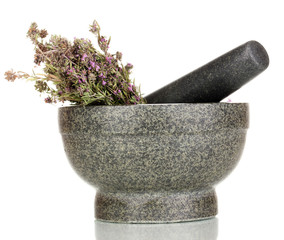 Thyme herb and mortar isolated on white