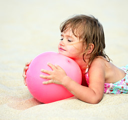 Girl plays with a ball