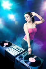 Beautiful DJ girl at the club