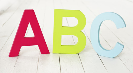 large painted ABC letters on floorboards