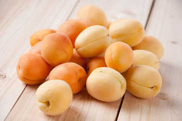 Horizontal shot of ripe apricots on wooden boards