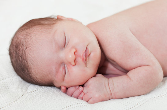 sleeping newborn child close up
