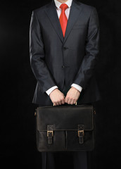 Portrait of successful business man with bag