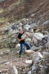 the man picks up a stone on the career