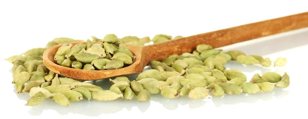 Fotobehang green cardamom in wooden spoon on white background close-up © Africa Studio