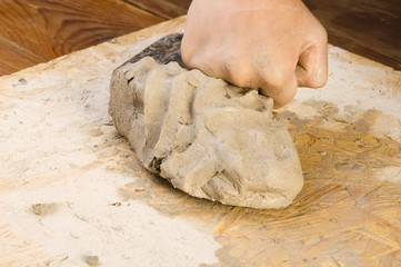 Child hands of a potter