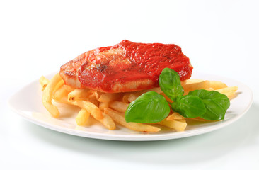 Pork steaks in tomato sauce with fries