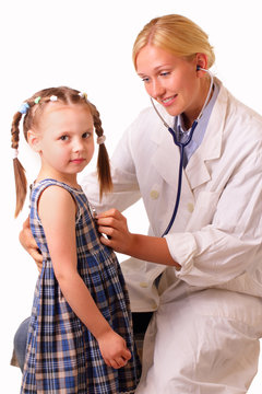 Young doctor woman examines beautiful child