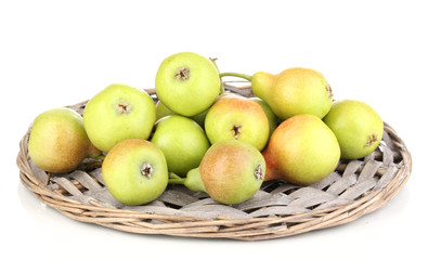 ripe pears on wicker mat isolated on white.