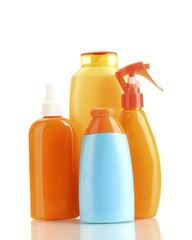 Bottles with suntan cream isolated on white