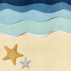 Fototapeta na wymiar Starfish on beach recycled papercraft background
