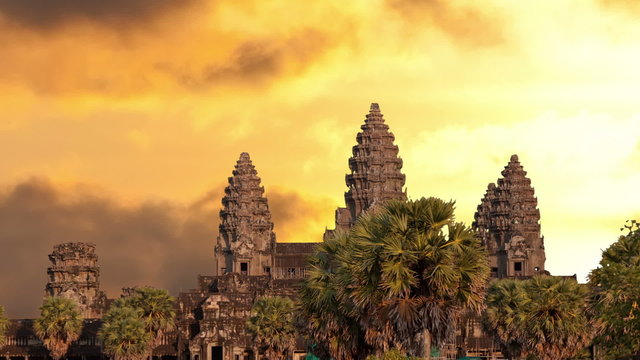 Angkor Wat temple silhouette with sunset sky and clouds