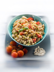 spelt risotto with beans and tomatoes, selective  focus,