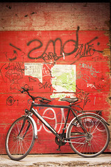 bicycle against wooden wall