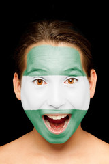 girl with andalusian flag on her face