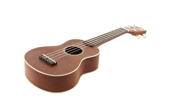 Small guitar (ukulele) focus body on white background.