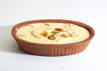Indian sweet Firni in oval shaped earthen bowl