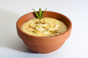 Indian sweet Firni in round earthen bowl