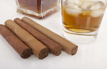 Whiskey glass and cigar. Isolated on white background  