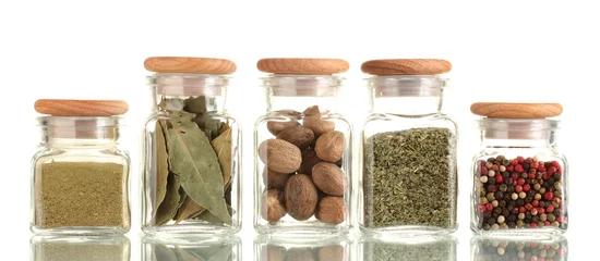 Rolgordijnen powder spices in glass jars  isolated on white © Africa Studio
