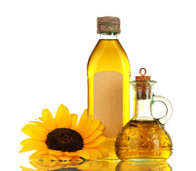 oil in jars and sunflower, isolated on white