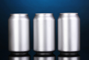 aluminum cans on blue background