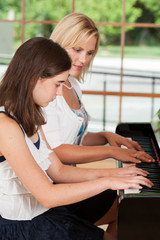 Piano teacher and student