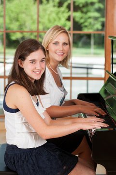 Piano teacher and student