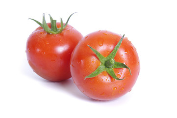 Two tomato isolated on white background